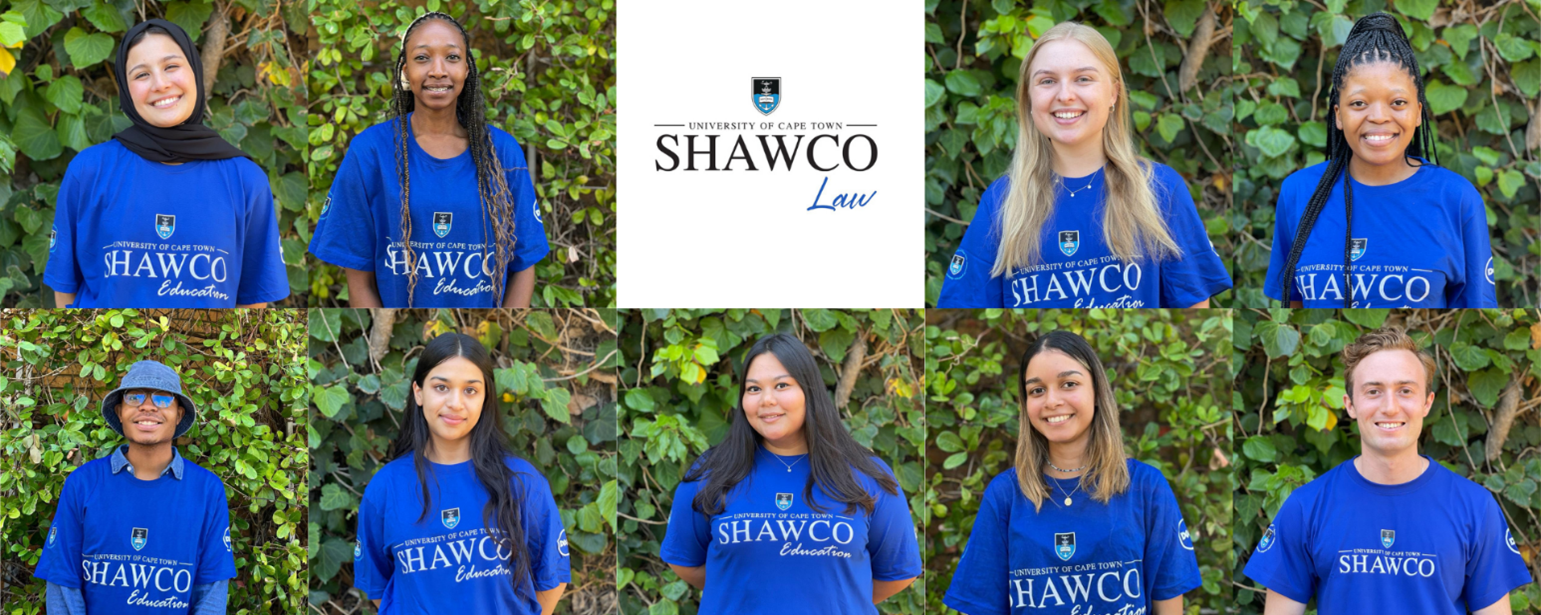 SHAWCO law committee in matching t-shirts smiling at camera